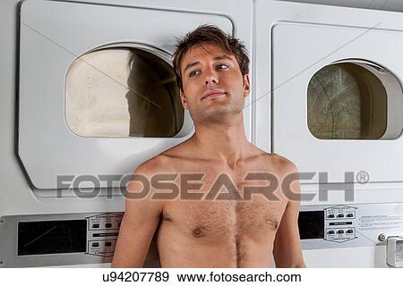 Stock Photo - Man waiting for clothes. Fotosearch