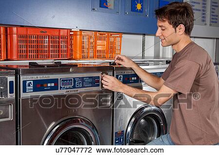 Man washing clothes in the laundry View Large Photo Image Stock Image - Man washing clothes in the laundry. Fotosearch