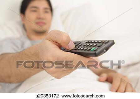 Man watching tv View Large Photo Image Stock Image - Man watching tv. Fotosearch