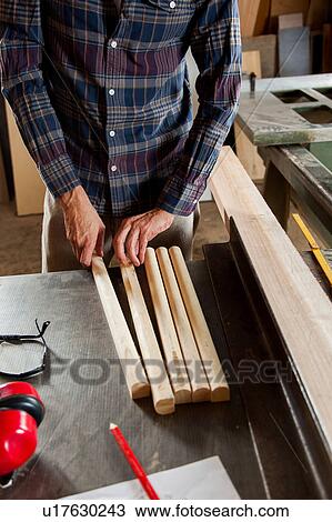Man with pieces of wood View Large Photo Image Stock Image - Man with pieces of wood. Fotosearch