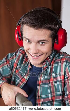 Man with protectors hearing View Large Photo Image Stock Photo - Man with protectors hearing. Fotosearch