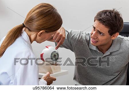 Picture - Man worried about the eye. Fotosearch