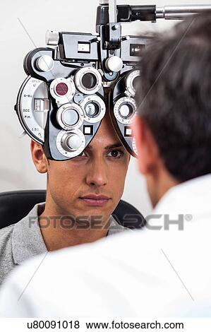 Stock Photo - Man worried about what the doctor says. Fotosearch