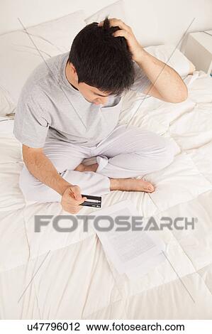 Man worried by contract View Large Photo Image Stock Image - Man worried by contract. Fotosearch