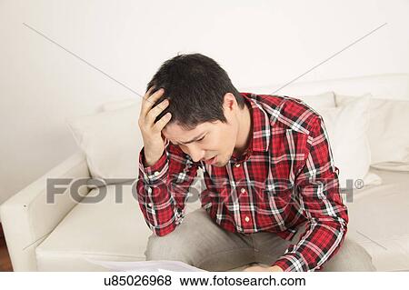 Man worried by contract View Large Photo Image Stock Photo - Man worried by contract. Fotosearch