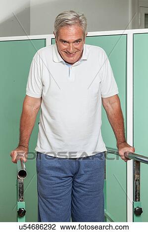 Mature man rehabilitating his legs View Large Photo Image Stock Image - Mature man rehabilitating his legs. Fotosearch