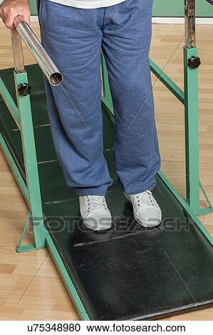 Mature man rehabilitating his legs View Large Photo Image Stock Image - Mature man rehabilitating his legs. Fotosearch
