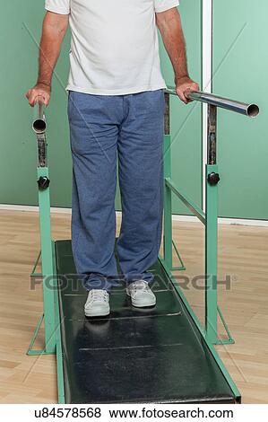Mature man rehabilitating his legs View Large Photo Image Stock Photo - Mature man rehabilitating his legs. Fotosearch