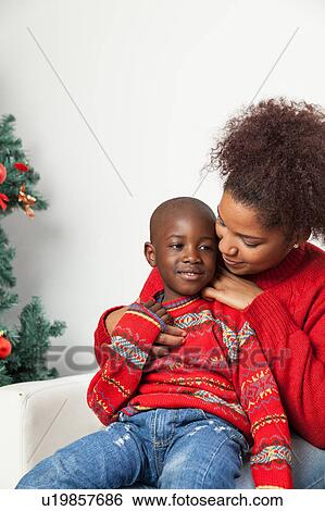 Stock Photograph - Mother hug her child. Fotosearch