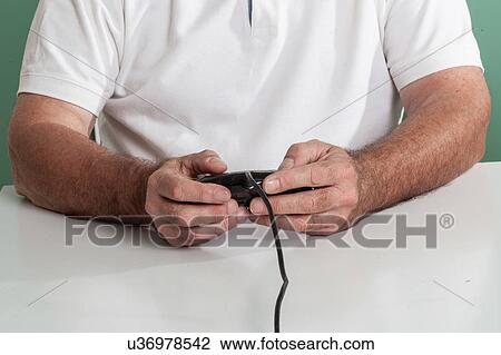 Old man playing videogames View Large Photo Image Stock Image - Old man playing videogames. Fotosearch