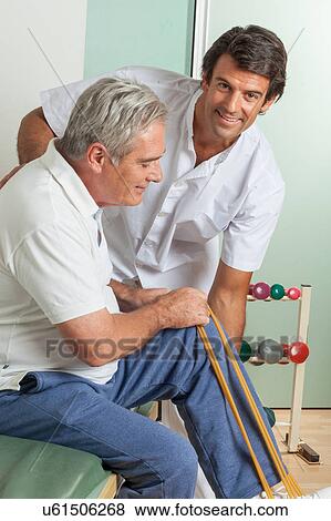 Old man with his doctor View Large Photo Image Stock Photo - Old man with his doctor. Fotosearch