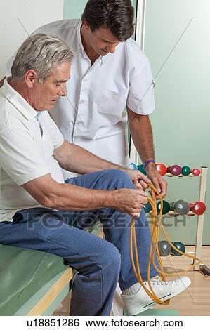 Old man with his doctor View Large Photo Image Stock Photograph - Old man with his doctor. Fotosearch