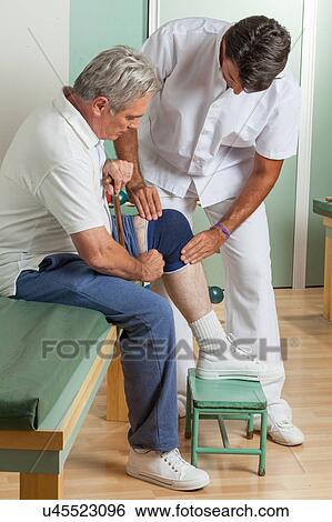 Old man with his doctor View Large Photo Image Stock Photograph - Old man with his doctor. Fotosearch
