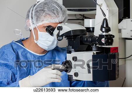 Stock Image - Ophthalmologist checking the eyes. Fotosearch