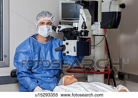 Stock Photography - Ophthalmologist checking the eyes. Fotosearch