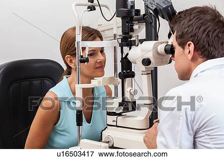 Stock Photo - Ophthalmologist doing studies. Fotosearch