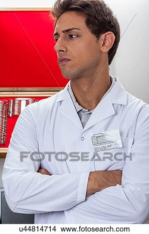Ophthalmologist idly View Large Photo Image Picture - Ophthalmologist idly. Fotosearch