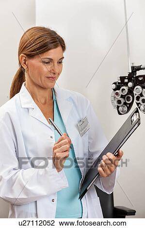 Ophthalmologist in his office View Large Photo Image Stock Image - Ophthalmologist in his office. Fotosearch