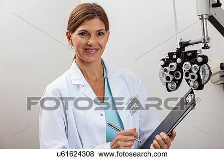 Ophthalmologist in his office View Large Photo Image Stock Photo - Ophthalmologist in his office. Fotosearch