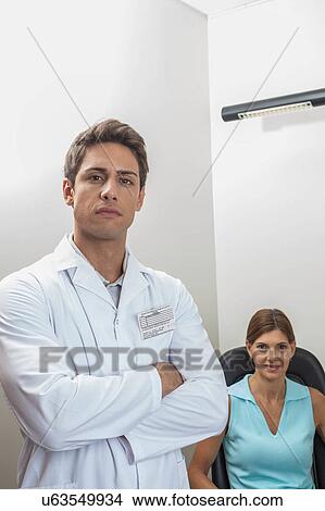Ophthalmologist looking at camera View Large Photo Image Picture - Ophthalmologist looking at camera. Fotosearch