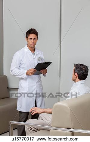 Stock Photo - Ophthalmologist looking at camera. Fotosearch