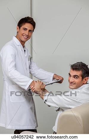 Ophthalmologist meeting the patient View Large Photo Image Stock Image - Ophthalmologist meeting the patient. Fotosearch