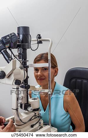 Ophthalmologist performing eye tests View Large Photo Image Picture - Ophthalmologist performing eye tests. Fotosearch