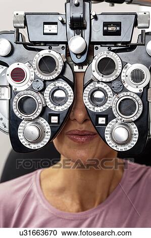 Ophthalmologist performing eye tests View Large Photo Image Stock Image - Ophthalmologist performing eye tests. Fotosearch