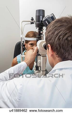 Ophthalmologist performing eye tests View Large Photo Image Stock Image - Ophthalmologist performing eye tests. Fotosearch