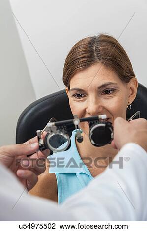 Ophthalmologist putting special lenses View Large Photo Image Stock Image - Ophthalmologist putting special lenses. Fotosearch