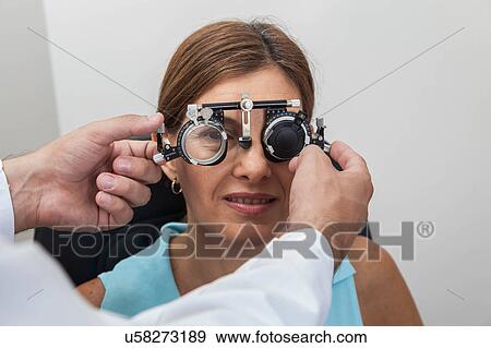 Ophthalmologist putting special lenses View Large Photo Image Stock Photo - Ophthalmologist putting special lenses. Fotosearch