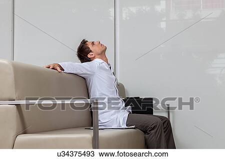 Stock Image - Ophthalmologist resting. Fotosearch