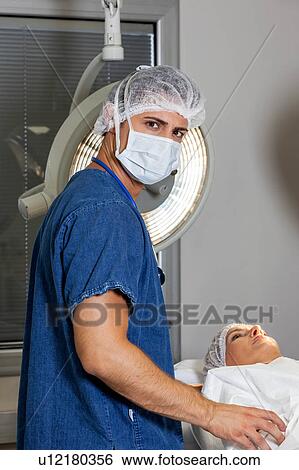 Stock Photograph - Ophthalmologist waiting to operate. Fotosearch