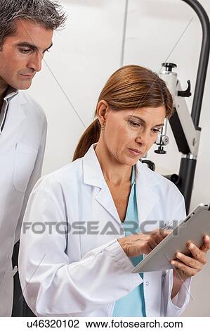 Ophthalmologists discussion View Large Photo Image Stock Image - Ophthalmologists discussion. Fotosearch