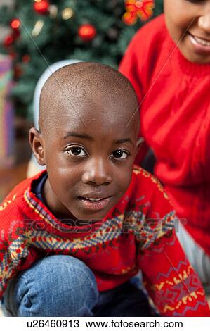Stock Image - Portrait of black boy on Christmas. Fotosearch
