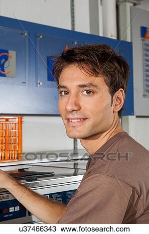 Portrait of man in the laundry View Large Photo Image Stock Image - Portrait of man in the laundry. Fotosearch