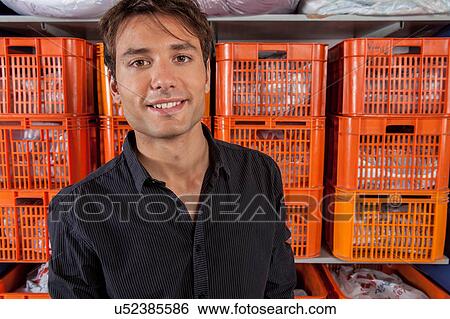 Stock Photograph - Portrait of man in the laundry. Fotosearch