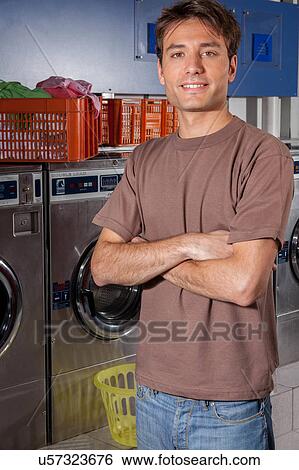 Stock Photograph - Portrait of man in the laundry. Fotosearch