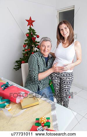 Stock Image - Pregnant in christmas. Fotosearch