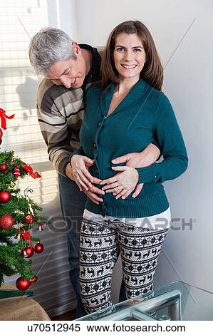 Pregnant woman in christmas View Large Photo Image Stock Photography - Pregnant woman in christmas. Fotosearch