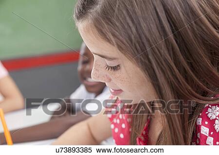 Stock Photography - Pretty girl concentrated. Fotosearch