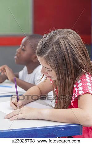 Stock Photo - Pretty girl drawing. Fotosearch
