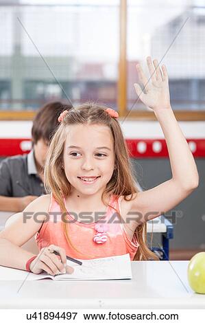 Pretty girl putting her hand up View Large Photo Image Stock Photo - Pretty girl putting her hand up. Fotosearch