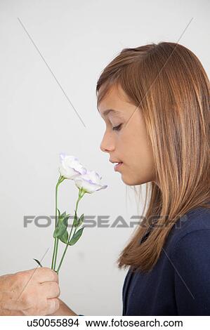 Picture - Pretty girl with flowers. Fotosearch