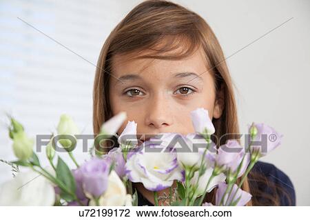 Pretty girl with flowers View Large Photo Image Stock Image - Pretty girl with flowers. Fotosearch