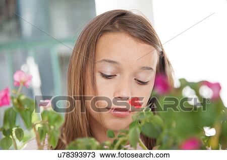 Stock Image - Pretty girl with flowers. Fotosearch
