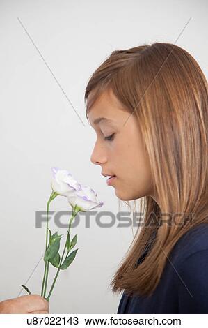 Stock Image - Pretty girl with flowers. Fotosearch