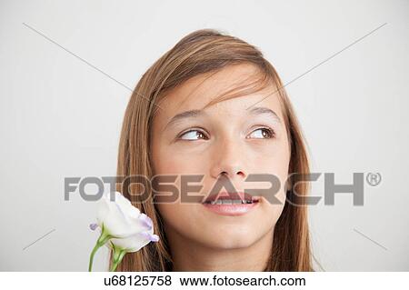 Stock Photo - Pretty girl with flowers. Fotosearch