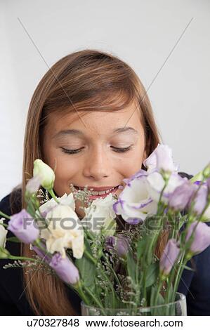 Stock Photo - Pretty girl with flowers. Fotosearch