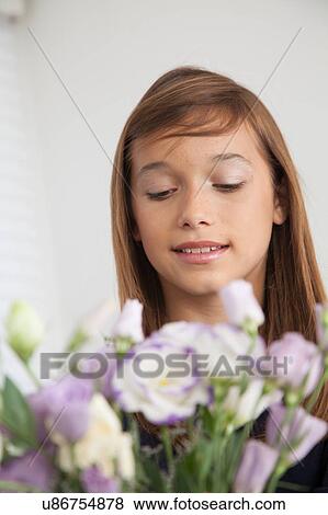 Pretty girl with flowers View Large Photo Image Stock Photo - Pretty girl with flowers. Fotosearch